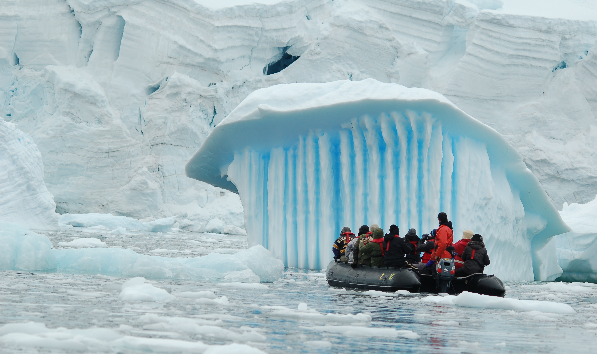 Getting close to a spectacular iceberg, shaped by glacial melting processe