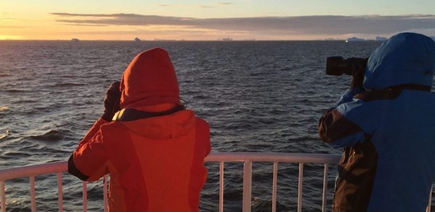 Photographing an Antarctic sunrise from the deck of a cruise ship