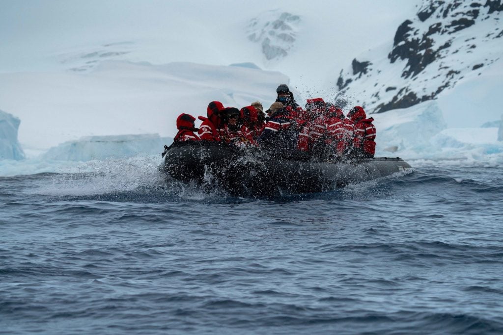 Zodiac with tourists in Antarctica