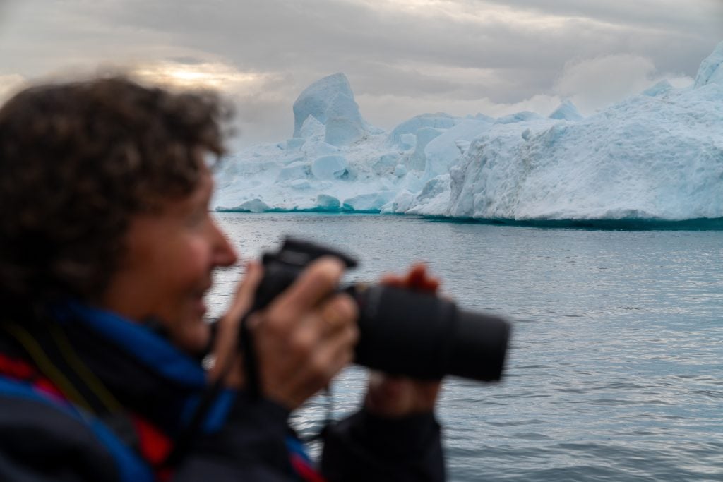 Photographer and iceberg
