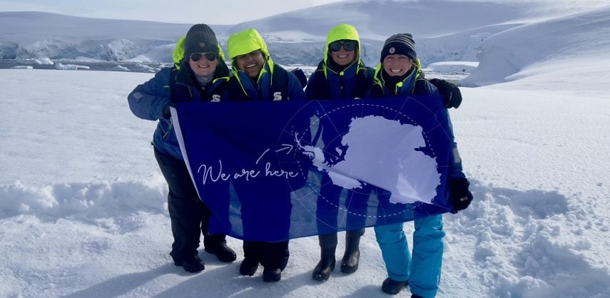 Four female tourists in Antarctica
