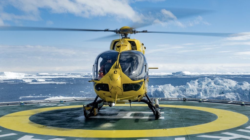 Helicopter on landing pad on Antarctic cruise ship
