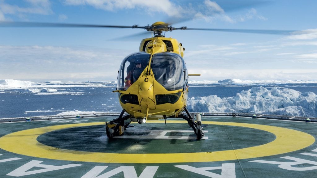 Preparing for a helicopter flight in Antarctica on the helipad of Ultramarine
