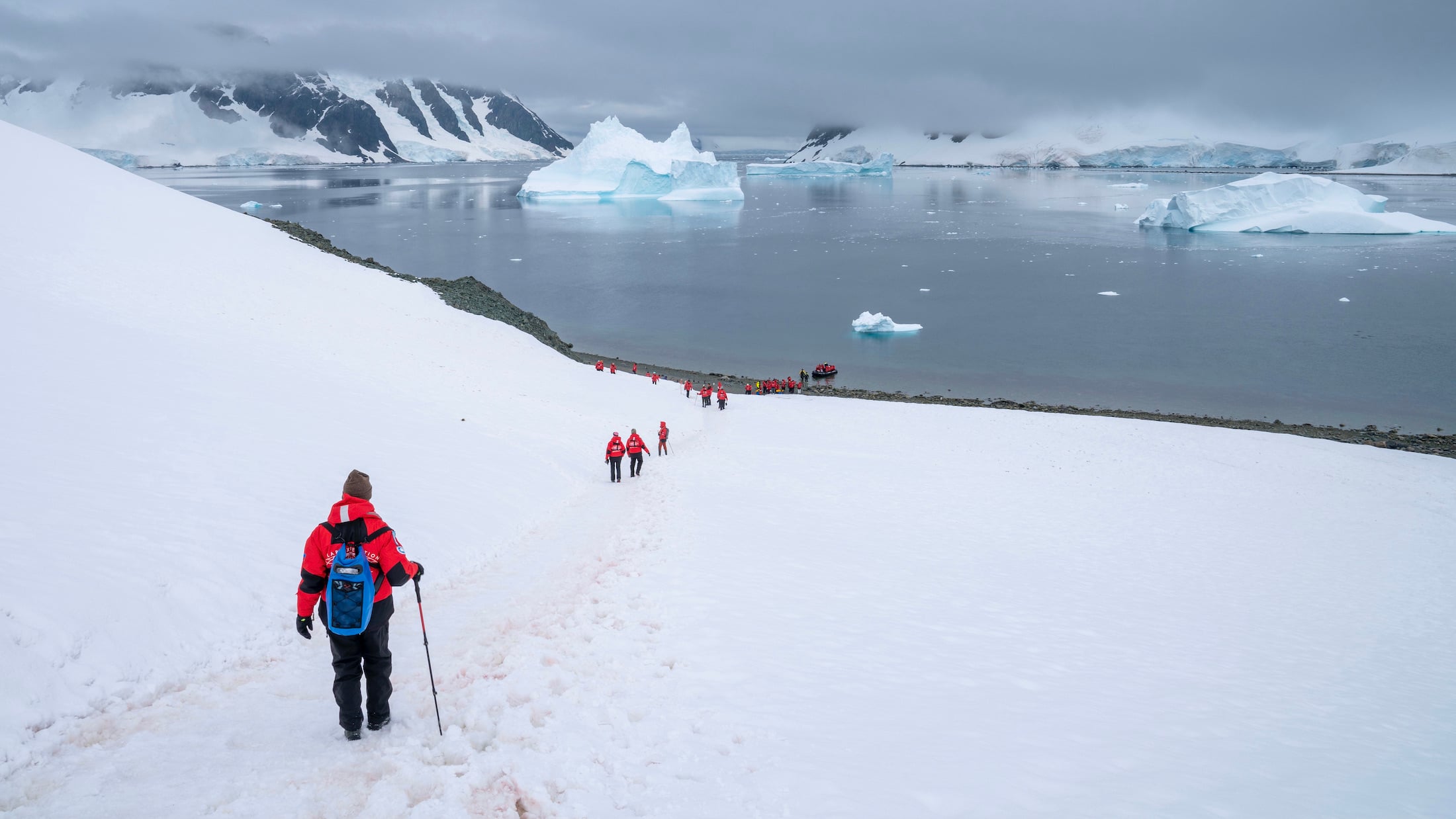 How does tourism benefit Antarctica?